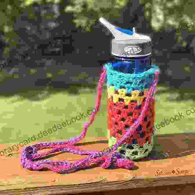 Completed Water Bottle Holder Little Purse Crocheted In Vibrant Pink Yarn, Featuring A Delicate Lace Like Pattern And A Sturdy Strap For Carrying Convenience. Water Bottle Holder Little Purse Crochet Pattern